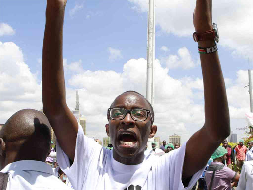 A striking doctor outside Afya House in Nairobi at the start of their nationwide strike over the fulfillment of a 2013 Collectuive Bargaining Agreement, December 5, 2016. /MONICAH MWANGI