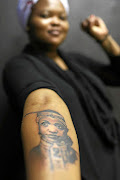 Musician Buhlebendalo Mda shows off her tattoo of Winnie Madikizela-Mandela. 