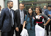 WAITING: Anni's brother Ashish Hindocha, left, father Vinod Hindocha, mother Nilam and sister Ami Denborg Picture: AFP