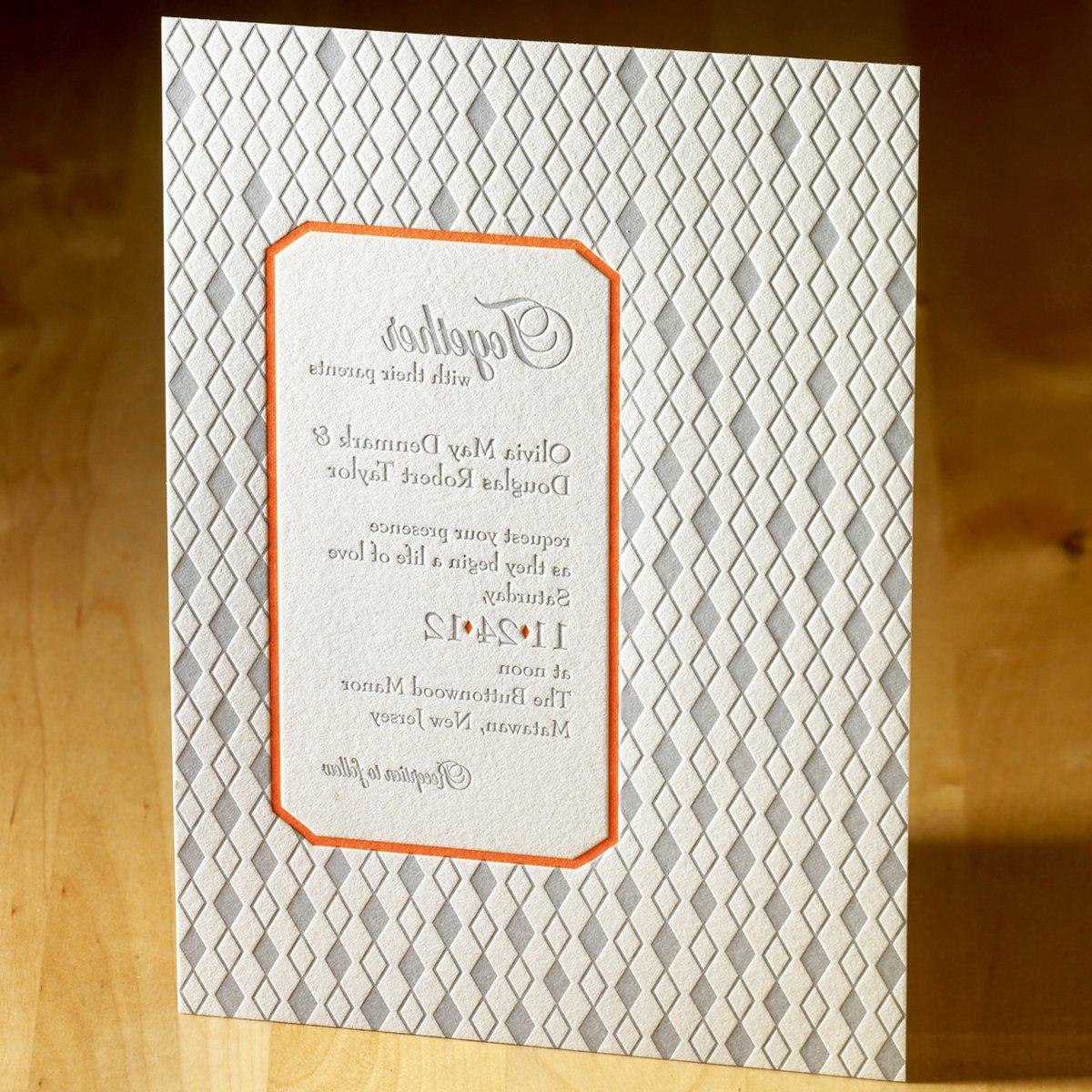 This remarkable letterpress wedding invitation features a mesmerizing