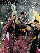 West Indies captain Darren Sammy holds the World Twenty20 trophy after the team's win in the final against Sri Lanka Picture: GARETH COPELY/GALLO IMAGES