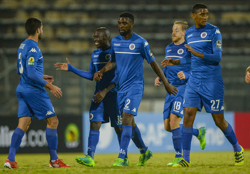 SuperSport United players celebrate with teammate Keegan Ritchie (L) after he scored during the CAF Confederations Cup match against Horoya from Guinea at Lucas Moripe Stadium on May 12, 2017 in Pretoria, South Africa.