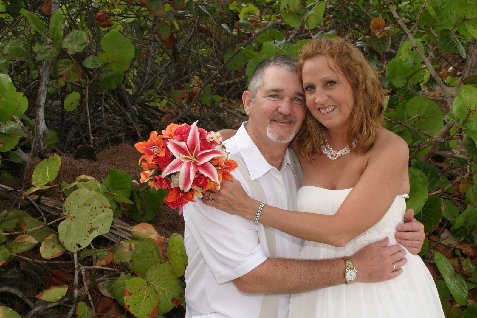 Beach foliage provided a lovely backdrop for this celebrating couple.
