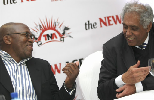 Former minister in the presidency, Essop Pahad (right) chats to ex broadcaster Vuyo Mvoko in July 2010. Archive image