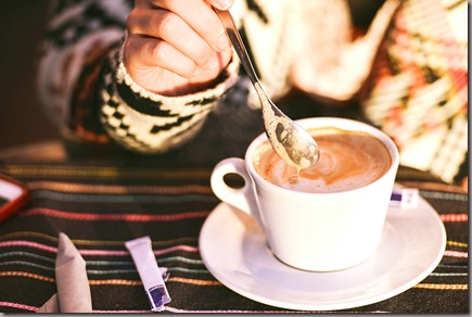 Woman-Stirring-Capuccino-Coffee-1024x683