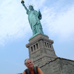 jose in front of the statue of liberty in New York City, United States 