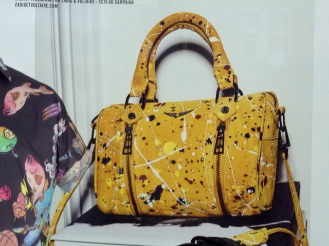 Yellow handbag with paint splashes