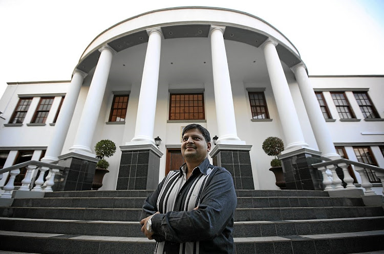 Atul Gupta in front of his palatial home in Saxonwold, Johannesburg.