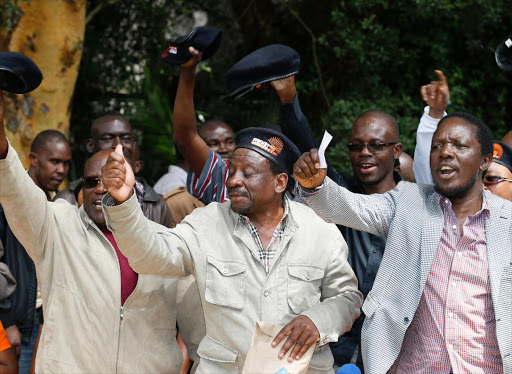 Cord members Johnstone Muthama, James Orengo, and Timothy Bosire lead their colleagues in chanting anti-IEBC slogans during a press conference where they vowed to press for IEBC ouster on May 23, 2016. Photo/Jack Owuor