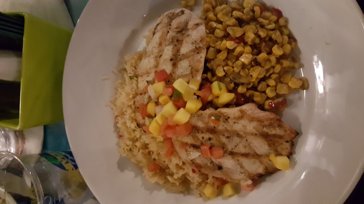 Grilled chicken with mango salsa and fire roasted corn