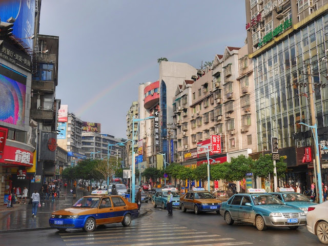 rainbow over a street scene in Shaoyang, Hunan