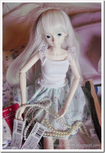 Ball Jointed Doll Showing Off Glass Pearls