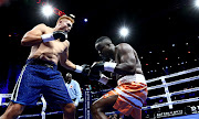 Ruann Visser lands a punch on Justice Silinga during their SA & WBA Pan African Heavyweight bout at SunArena in Menlyn, Pretoria, on June 23 2019.