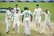 Kagiso Rabada of South Africa congratulates Anrich Nortje of South Africa for getting the wicket of Rory Burns batsman of England for 84 runs during day 4 of the first International Test Series 2019/20 game between South Africa and England at Supersport Park, Centurion on 29 December 2019.