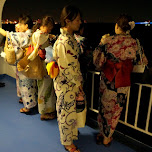 Japanese girls dressed in kimono's at the boat cruise in Tokyo, Japan 