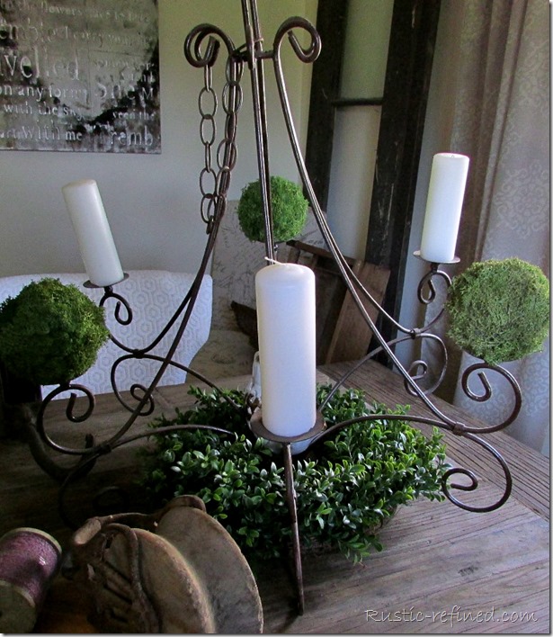 Rusty chandelier as a centerpiece for a rustic tablescape that celebrates Father's Day
