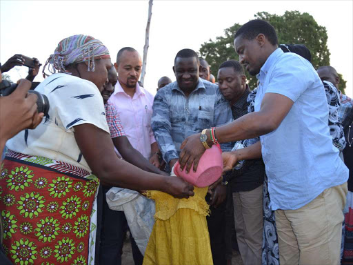 Lunga Lunga MP Khatib Mwashetani (in pink shirt), Governor Salim Mvurya, Mining CS Dan Kazungu and Devolution CS Mwangi Kiunjuri distribute relief food at Mwangulu, Kinango, in August / ALLOYS MUSYOKA