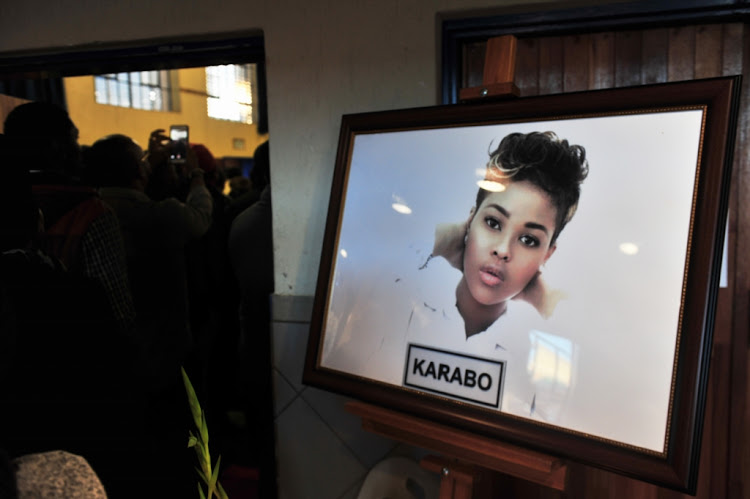 Friends and family gather during the memorial service of Karabo Mokoena at the Diepkloof Multipurpose Centre on May 17, 2017 in Soweto, South Africa.