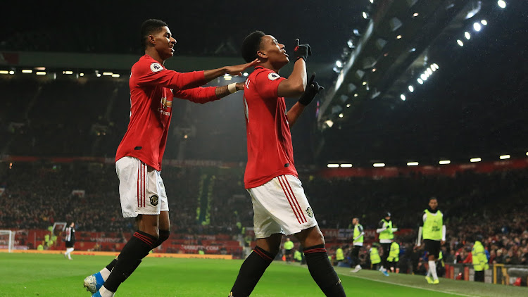 Strikers Anthony Martial celebrates with Marcus Rashford after scoring against Newcastle United at Old Trafford.