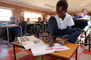 Limpopo's limbless girl, Mbali Mahlale, uses her right foot to write inside her grade four classroom at the Myngenoegen English Private School. Mbali was born without hands and only uses her right foot to write. She is the only disabled pupil at the school. PHOTO; ANTONIO MUCHAVE/SOWETAN