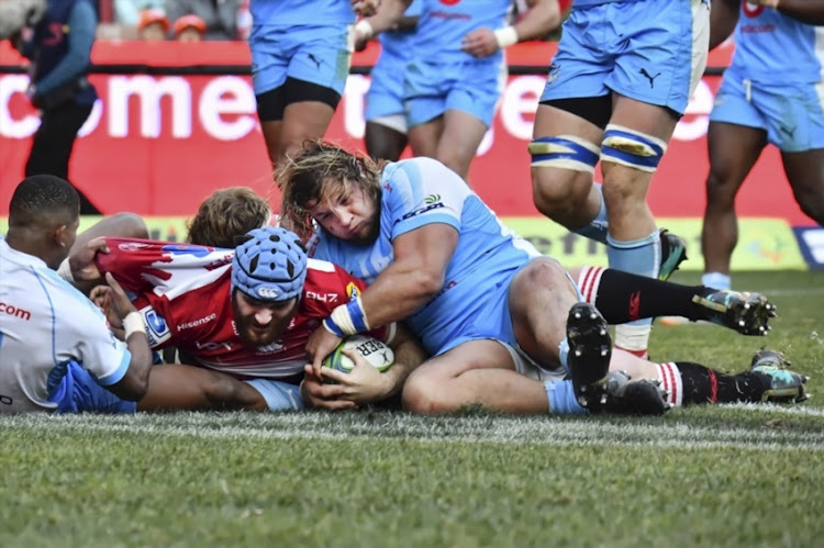 Lourens Erasmus of the Lions, Pierre Schoeman of the Vodacom Bulls during the Super Rugby match between Emirates Lions and Vodacom Bulls at Emirates Airline Park on July 14, 2018 in Johannesburg, South Africa.