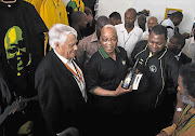 BUBBLY: President Jacob Zuma walks through the Progressive Business Forum tent at the ANC national conference yesterday