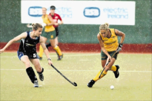 South Africa's Shelley Russell, sister of rugby Springbok Brent, controls the ball during the 2-2 draw against Scotland. Yesterday the South Africans hit back to beat Japan 5-1 Picture: HOCKEY PRESS