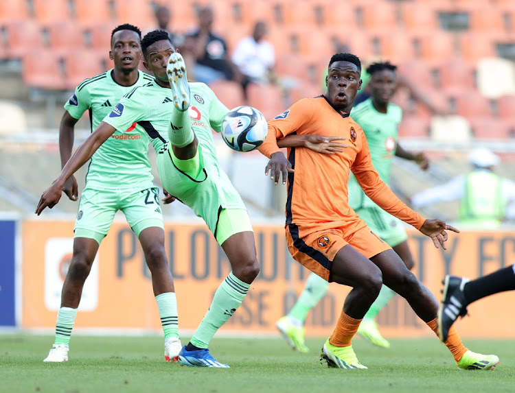 Mbatha Thalente of Orlando Pirates is challenged by Rodney Maphangule of Polokwane City during the DStv Premiership 2023/24 match at New Peter Mokaba Stadium in Polokwane on Saturday as they grabbed a crucial win away.