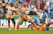 The Cheetahs' Adriaan Strauss is tackled as he tries to break out during yesterday's match against the Force in Bloemfontein