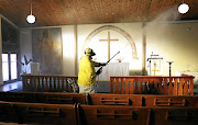 Sanitising the Evangelical Lutheran Church in  Athlone, Cape Town. File photo. 