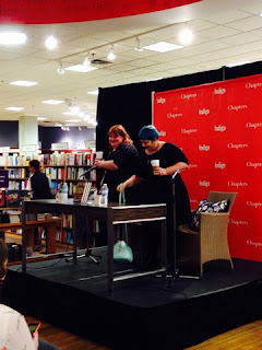 Cassie and Holly sitting down for the event. Cassandra Clare and Holly Black sitting down.