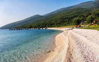 The only beach in Karaburun peninsula which is commercialized during peak season