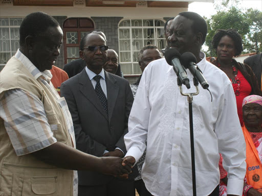 A file photo of Cord leader Raila Odinga and former Forestry minister Noah Wekesa. /JUSTUS OCHIENG