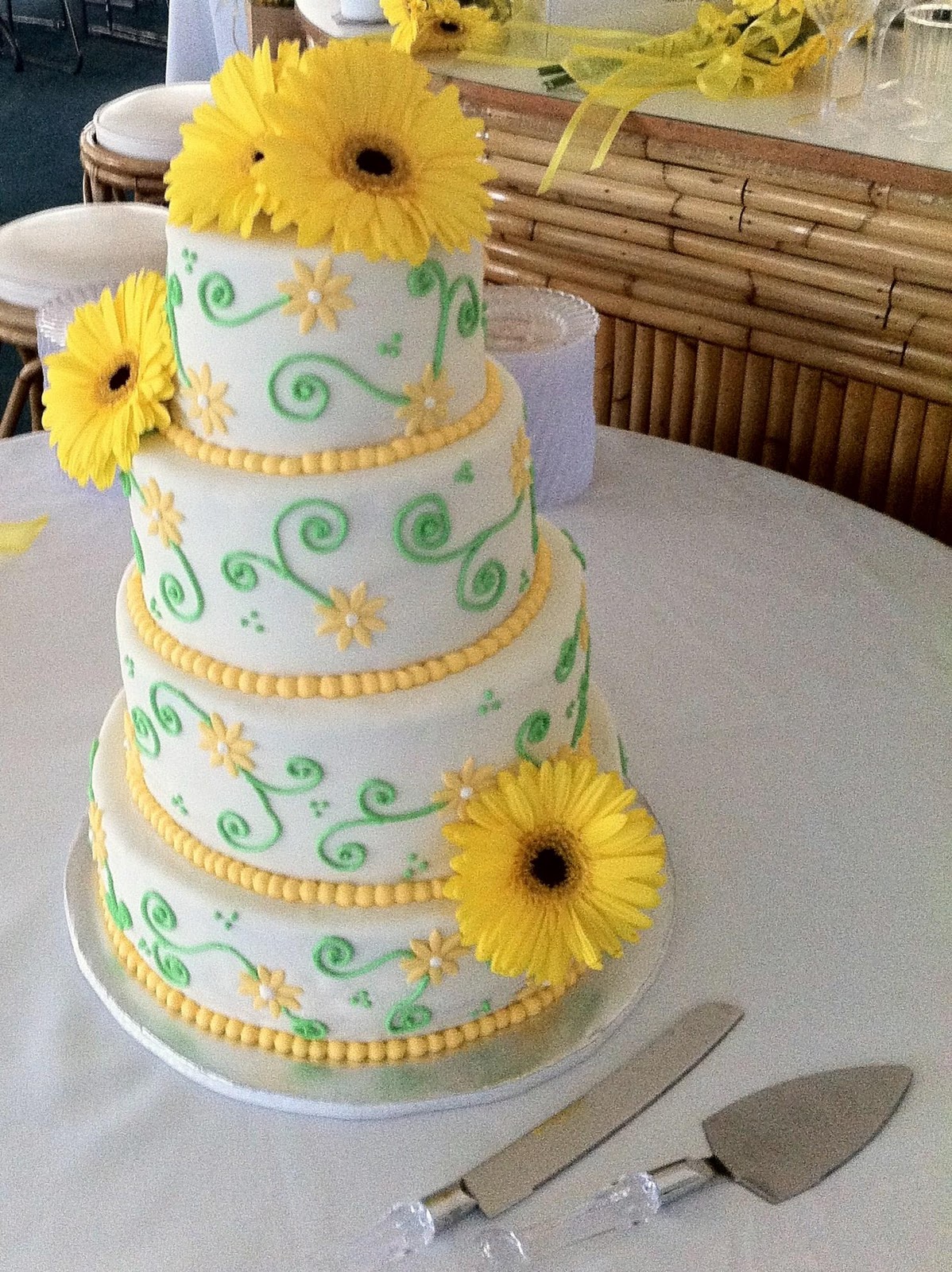 yellow daisy and green scroll