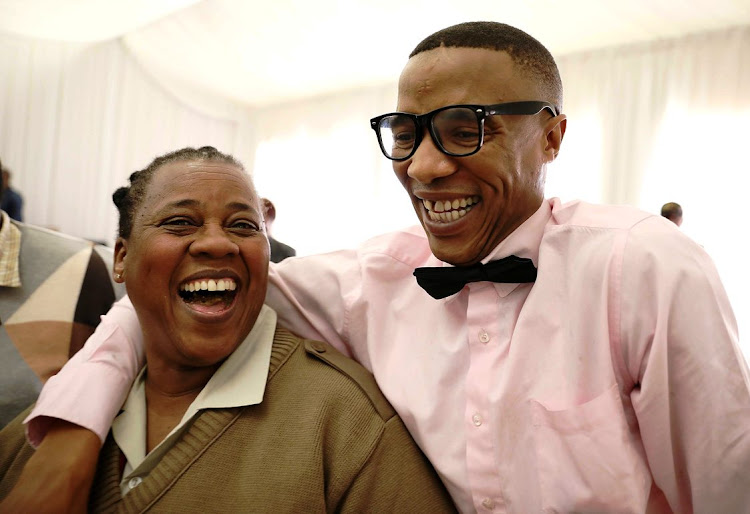 Prisoner Lubabalo Fongoqa celebrates his achievement with centre official, Ntombi Makwasa, at the end of course celebration at the Brandvlei prison on October 8 2019.