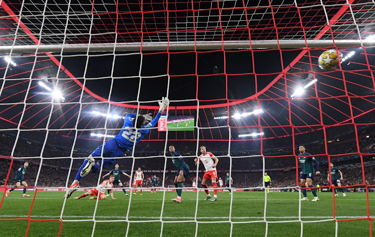 Joshua Kimmich scores for Bayern Munich past Arsenal's David Raya in their Champions League quarterfinal second leg at Allianz Arena in Munich on Wednesday night.