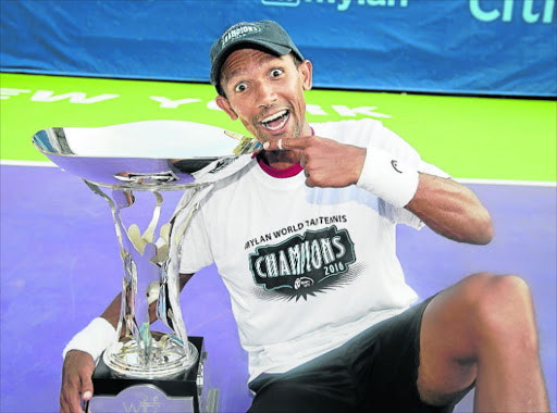 SURPRISE, SURPRISE: Raven Klaasen, holds the trophy he helped his team win at the World Team tennis championships at the weekend, will look to take his impressive form into his US Open campaign this week
