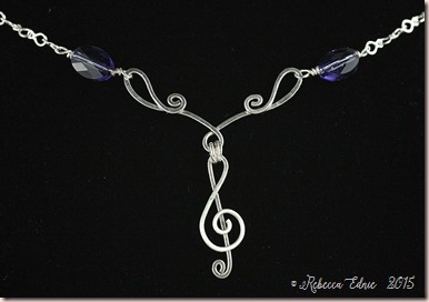 treble clef and flourish necklace