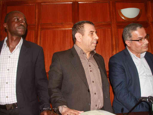 Kenyan driver Moses Mmboga and Iranian nationals Sayed Ebrahimi and Abdolhosein Safafe stand in the dock at Milimani law courts where they were charged for taking video clips of the Israeli embassy in Nairobi, December 1, 2016. /REUTERS