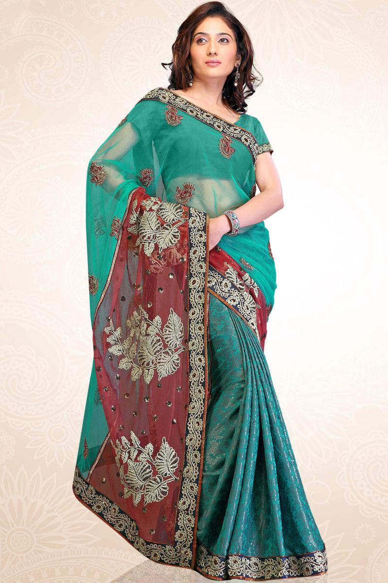 Turquoise Blue Net and Faux Georgette Embroidered Saree   97.00