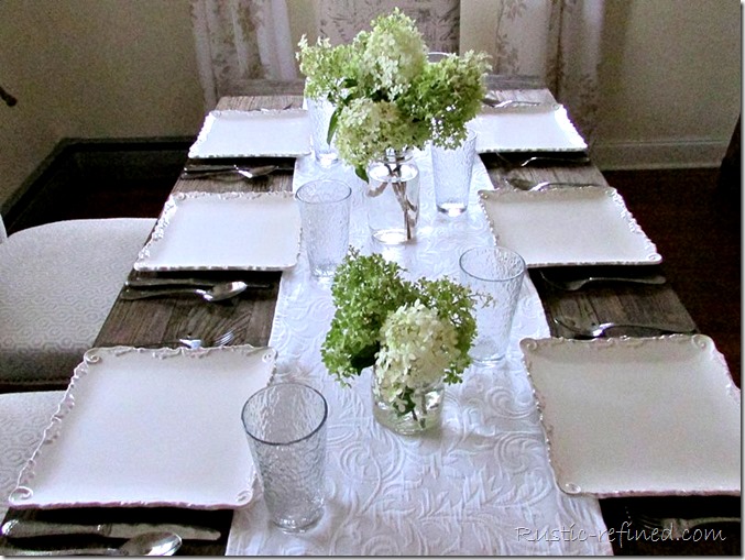 SImple white plates setting a beautiful rustic tablescape