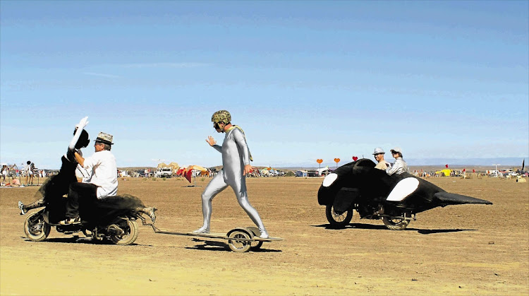 Participants at AfrikaBurn in the Tankwa Karoo get down to frivolous fun in the desert dust.