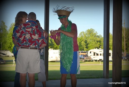 Bryce getting into the Hawaiin Hula outfit