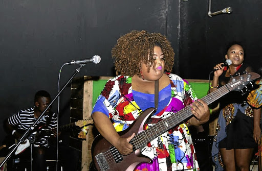 Tebogo Sedumedi plays bass guitar.