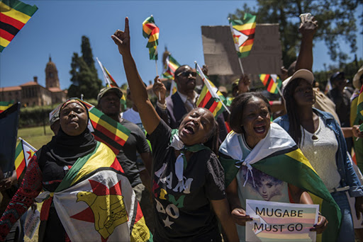 Zimbabweans dance in the streets as Mugabe resigns. Picture: FILE