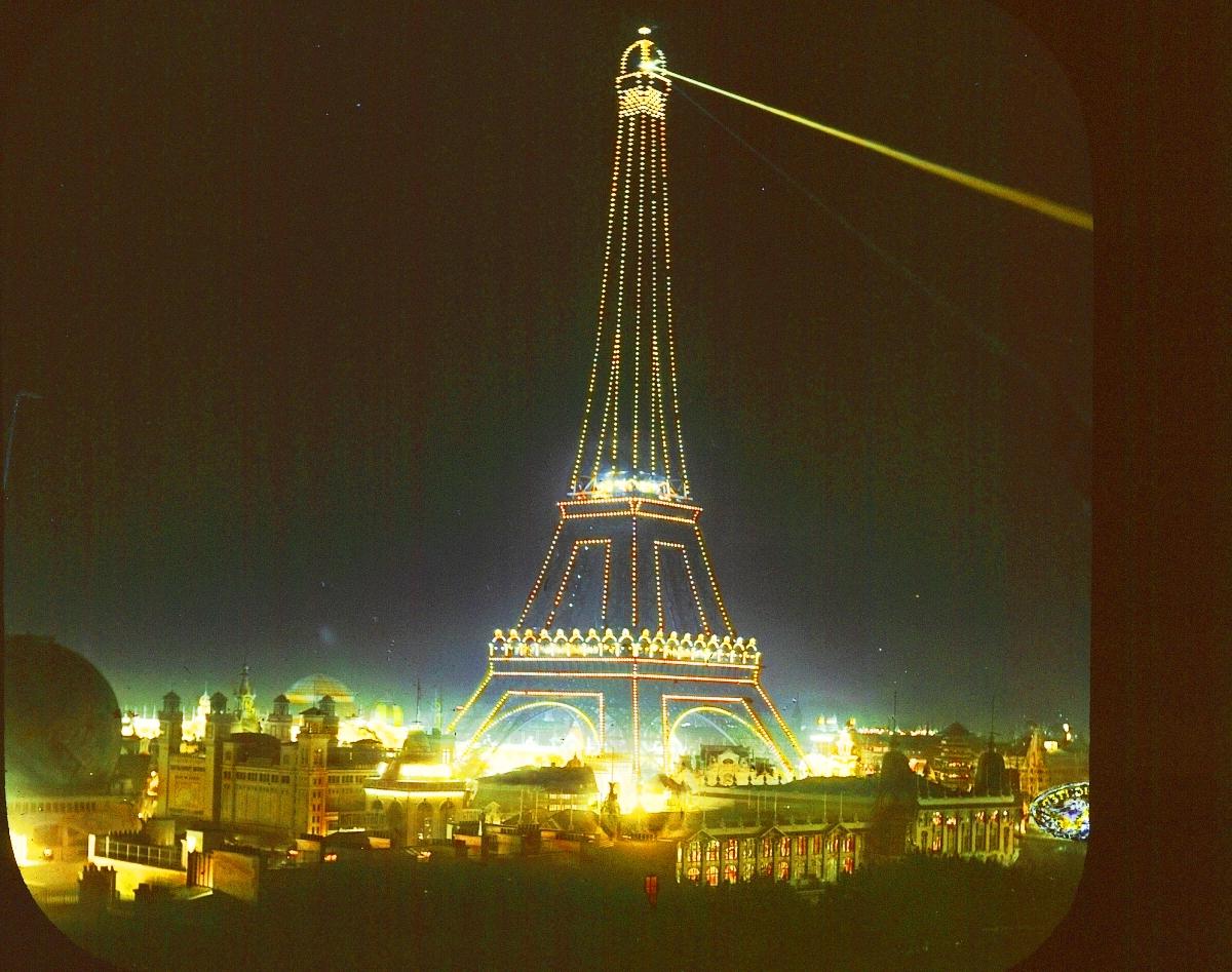 Eiffel Tower at night, lit up.