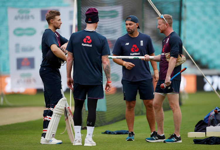 A file photo of Paul Collingwood (R) having a discussion with captain Joe Root and Ben Stokes during a nets training session at the Oval in London in September 2019.