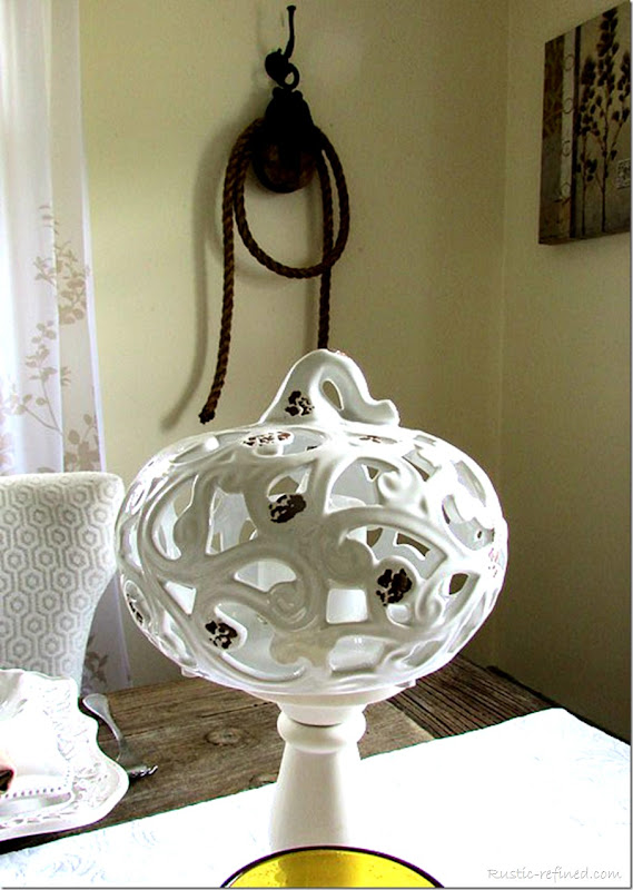 White ceramic pumpkins on a candle holder to elevate that farmhouse decor