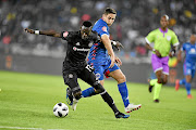 Augustine Mulenga of Orlando Pirates and Dean Furman of SuperSport United. 