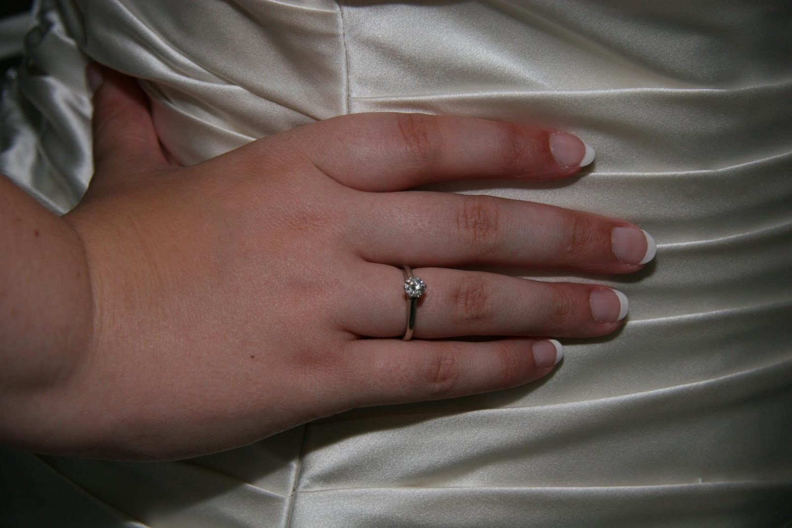 Engagement ring and wedding dress wedding dress. Image by balleyne
